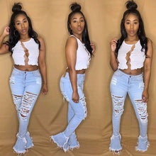 Jeans w/ fringed holes